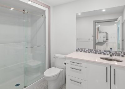 Fully finished bathroom featuring a spacious shower, elegant fixtures and modern comforts.